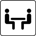 Meeting room. The icon shows two sitting people with a table top between them against a white background.