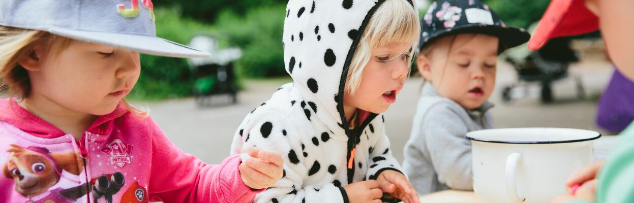 Children eating at the playground.