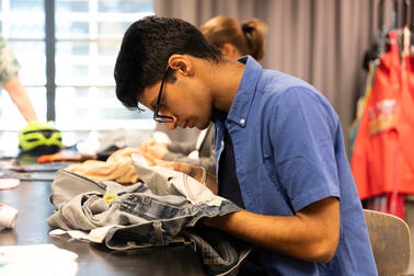 Clothing modification at a circular economy event.