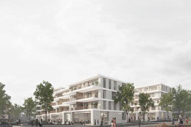 Ihmisiä kävelee kahden modernin asuinkerrostalon vieressä. Rakennusten pohjakerroksissa on liiketilaa.